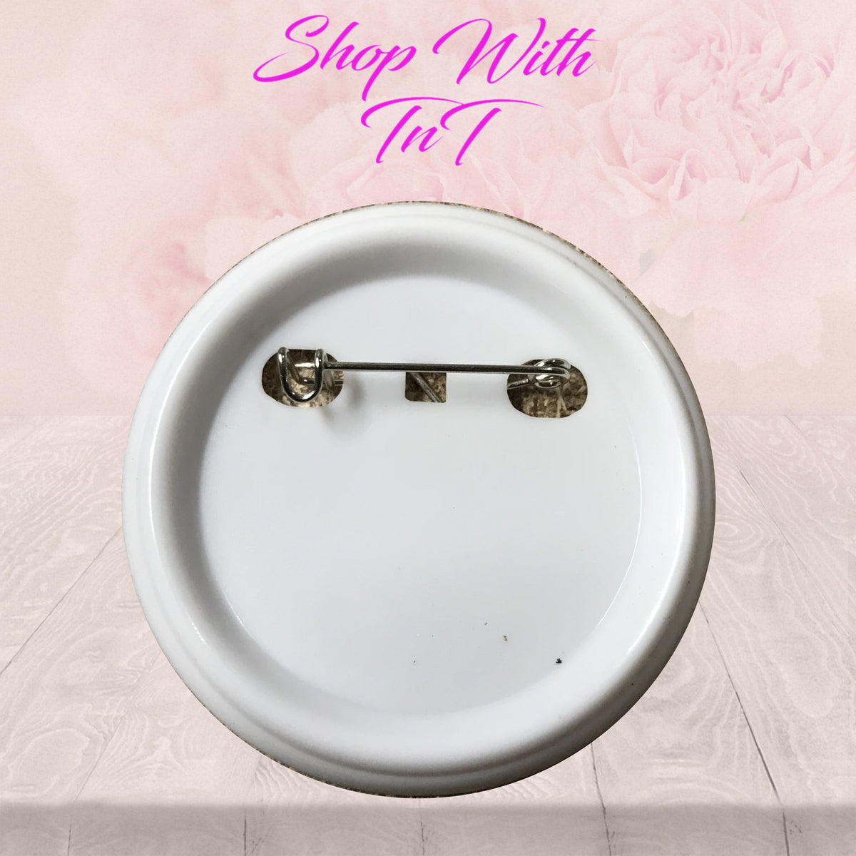 Back of 2.25 inch pinback button showing metal pin clasp