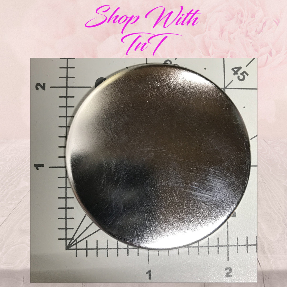 Size reference: 2.25 inch pinback button on a ruler