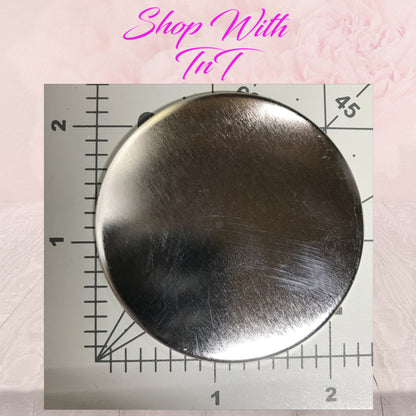 Size reference: 2.25 inch pinback button on a ruler