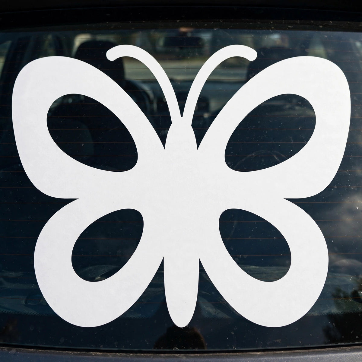 Butterfly decal applied to a truck rear window