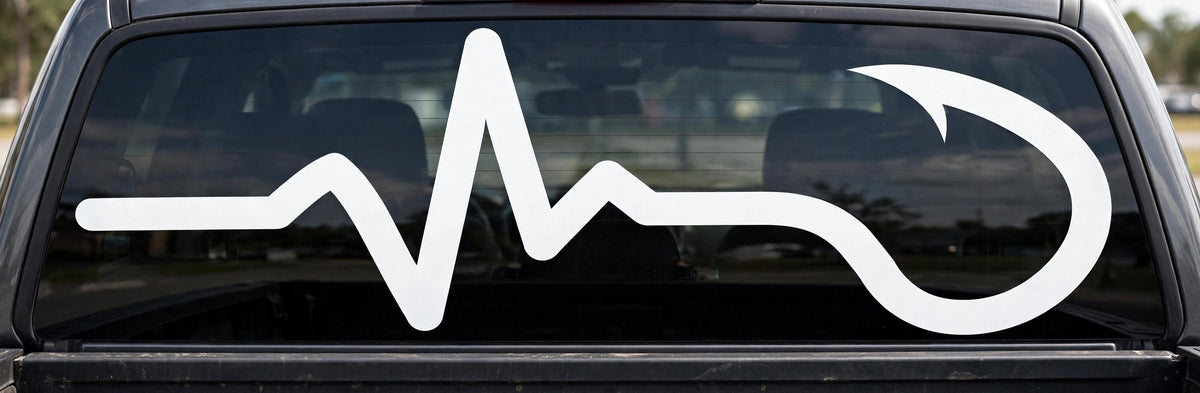 Fishing Heartbeat decal applied to a truck rear window