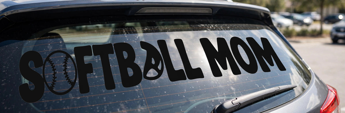 Softball Mom decal applied to a truck rear window